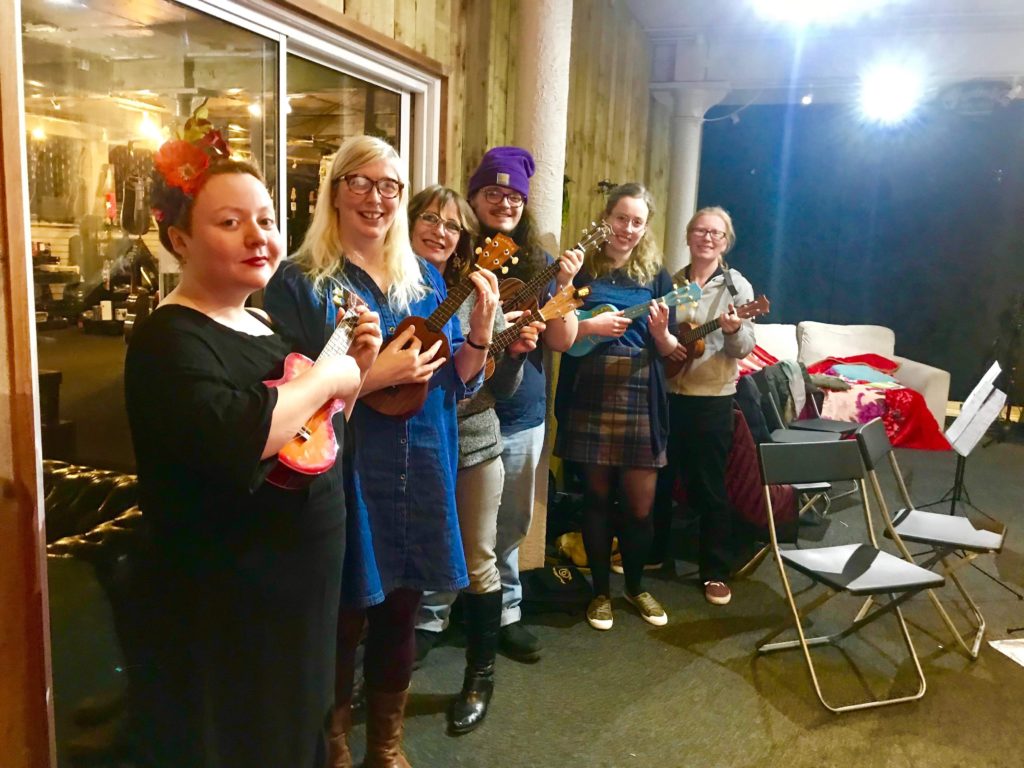 Members of the First Chord Ukulele Orchestra playing together
