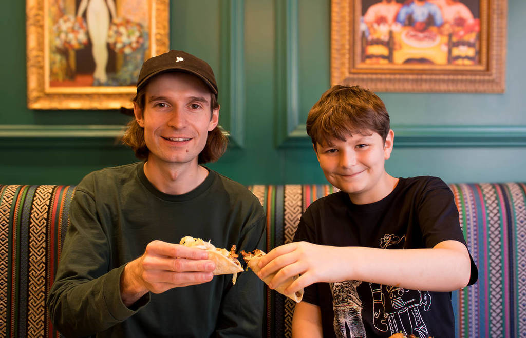 First Chord tutor Tom Walters and student Sonny Adams sharing tacos at Topolabamba